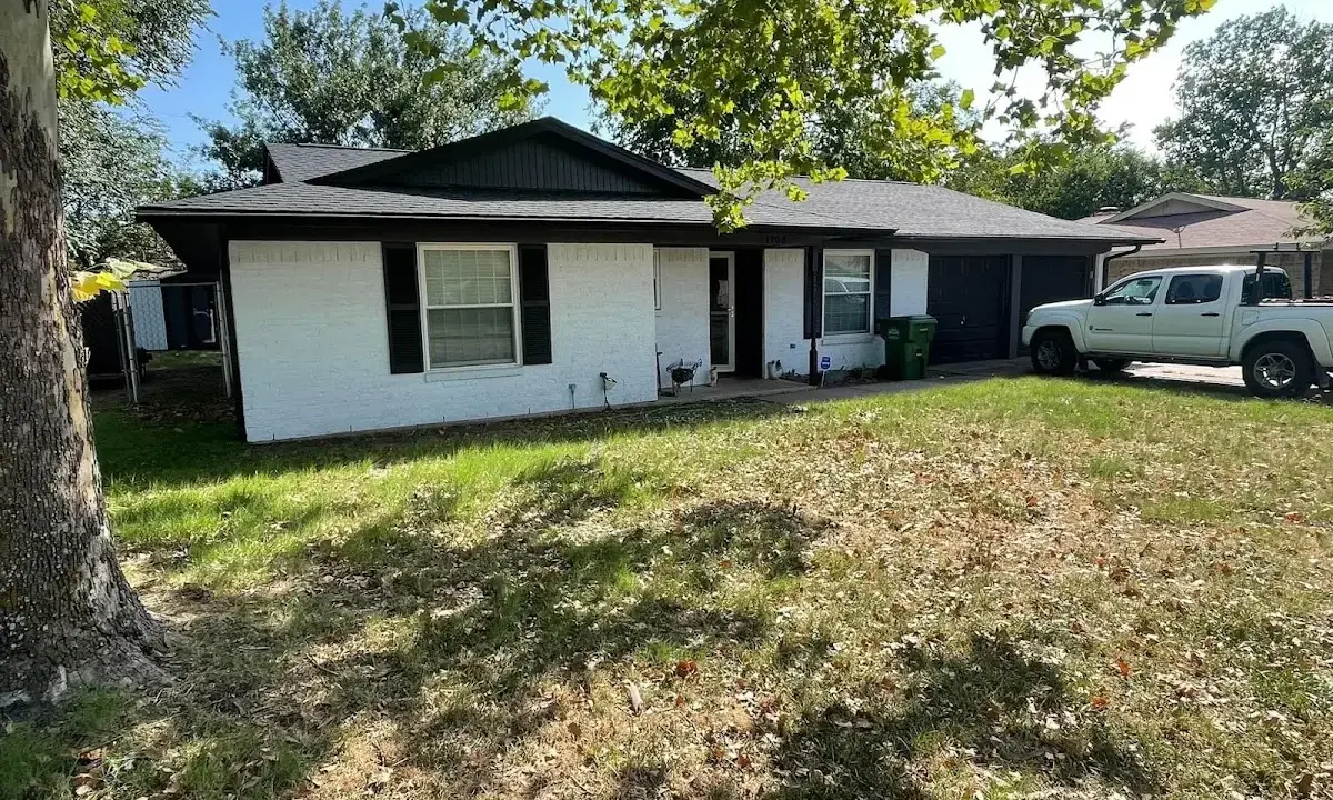 Professional roofing crew working on a residential roof in Jordan